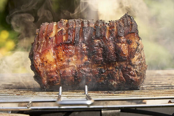 Super-hot jerk pork shoulder on barbecue grill