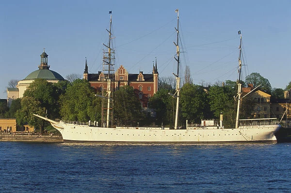 Sweden, Stockholm, af Chapman, built in 1888, the full-rigged former freighter and school ship has served as a popular youth hostel since 1949. Skeppsholmen Church, left and the Admiralty House, 1647-50, rebuilt 1844 to 1846, are in the background