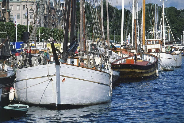 Sweden, Stockholm, front view of an old wood-carrying boat moored alongside the Strandvagen quay