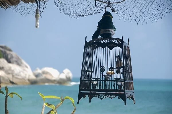 Thailand, Ko Phangan, Hat Yuan, view of bird cage with sea in the background