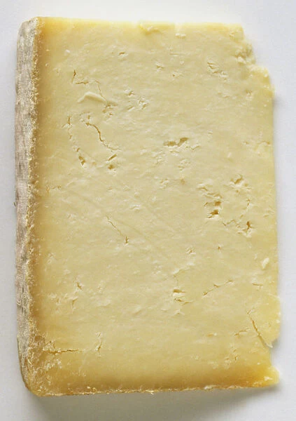 A thick slice of Cheshire cheese, close up