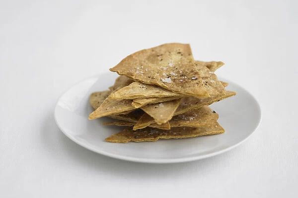 Tortilla chips on plate, close-up