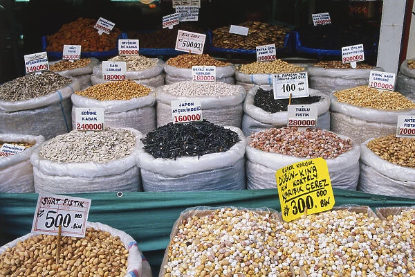 Turkey, Instambul, Spice Bazaar, stall selling nuts and seeds in white sacks, labels displaying prices