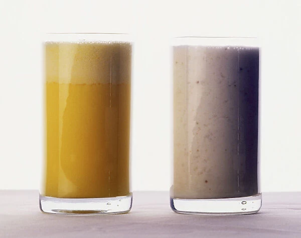 Typical Indian drinks, glasses of Kesar, yellow coloured Saffron flavoured lassi, and white lassi, yoghurt drink
