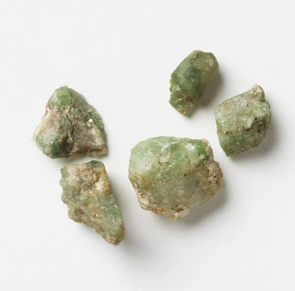 Five unpolished emerald rocks, close up