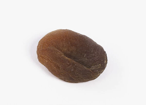 Unsulphured dried apricot against white background