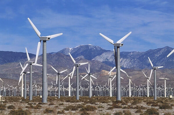 USA, California, Coachella Valley, field of wind turbines against mountain backdrop