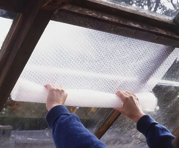 Using bubble wrap to insulate glass in greenhouse