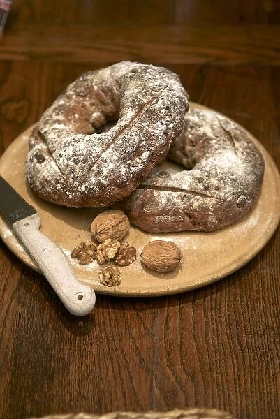 Walnut bread on board with knife