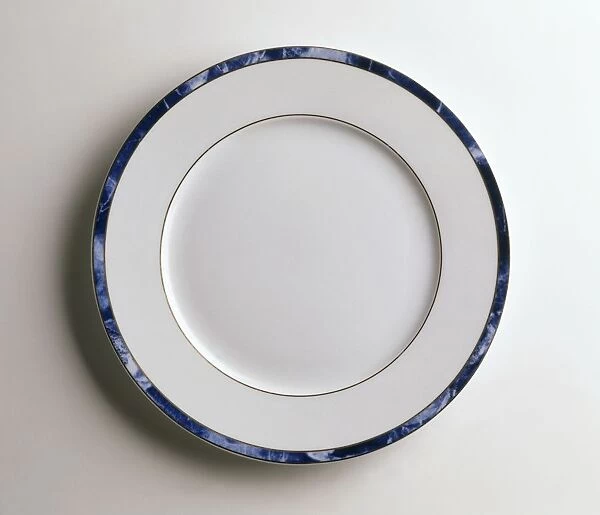A white plate with blue rim