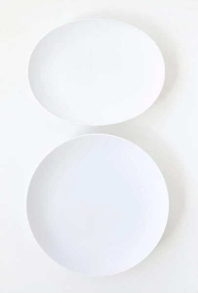 White plates on white background