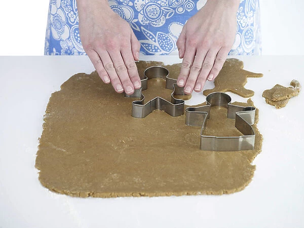 Woman making gingerbread cookies, close-up