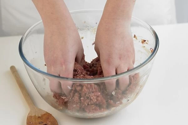 Woman mixing beef mince in bowl