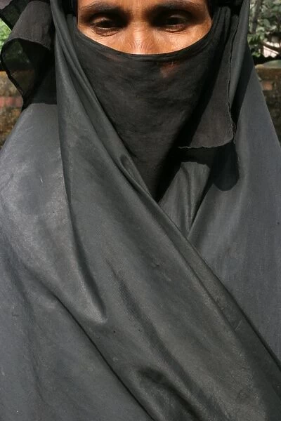 Woman wearing a black islamic burqa