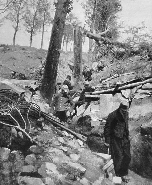 World War I 1914-1918: French soldiers examining a trench damaged by enemy action