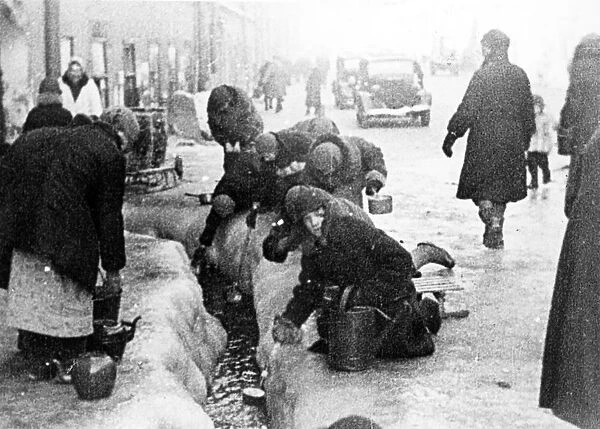 world war ll: the siege of leningrad, women taking water flowing from broken water mains