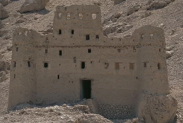 Yemen, Hadhramaut province, traditional mud brick building on sid eof mountain