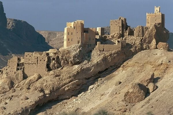 Yemen, Province of Sanaa, traditional mud brick houses on mountain side