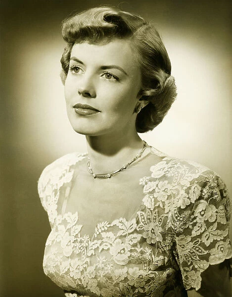 Woman wearing lace dress posing in studio, (B&W), (Close-up), (Portrait)