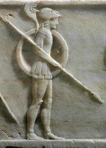 Base of a kouros statue : hoplite, citizen soldier armed with spear ans shield