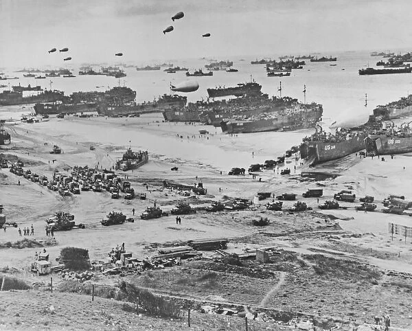 Bird s-eye view of landing craft, barrage balloons, and allied troops landing in Normandy