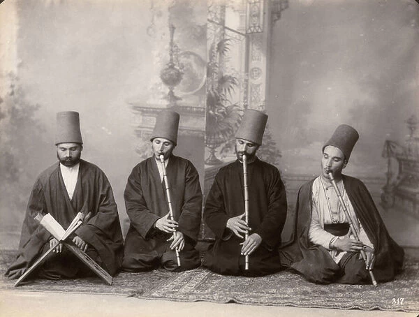 Three Dervish musicians and a singer, Turkey, c. 1890 (b  /  w photo)
