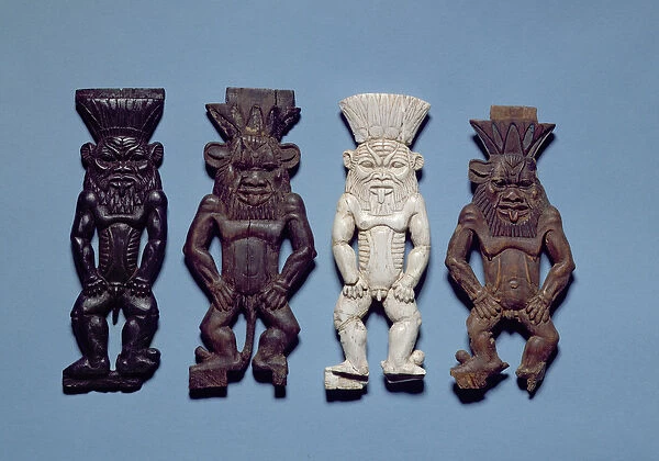Four figures of the grotesque deity Bes, New Kingdom (wood and ivory)