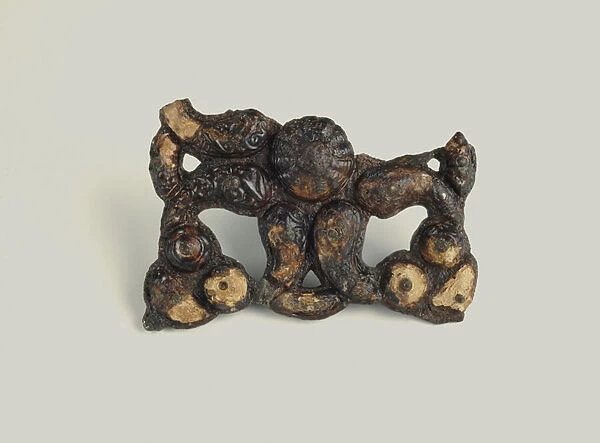 Iron and bronze ornament, with coral, 350-300 BC