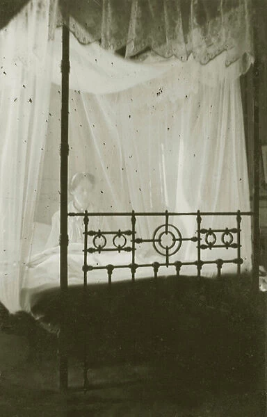 Four poster bed with fly net (b  /  w photo)