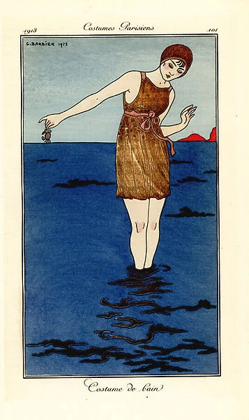 Woman in swimming costume up to her ankles in the sea on a beach holding a crab. Costume de bain. Handcoloured pochoir (stencil) etching after an illustration by George Barbier from Tommaso Antonginis Journal des Dames et des Modes