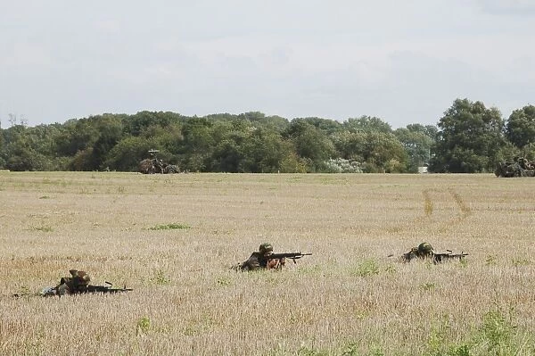 Belgian paratroopers on guard in the fields