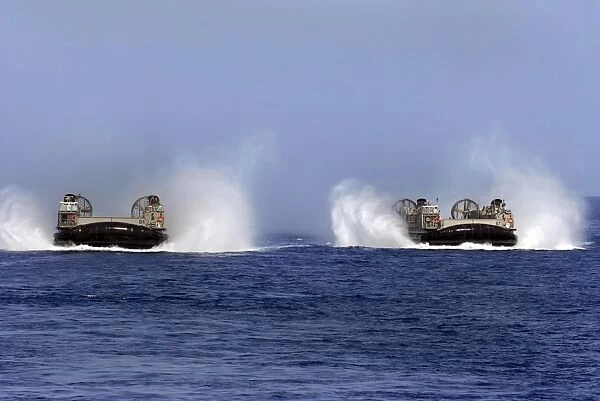 Landing Craft Air Cushion 84 and 87 conduct operations in the U