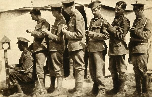 British soldiers synchronising their watches on the front line, First World War, 1914-1918, (1933)