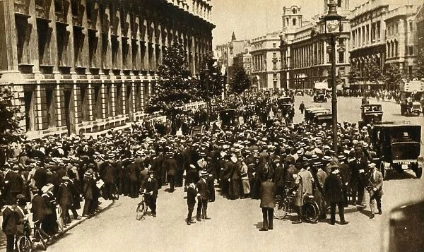 Crowds waiting outside Downing Street in London for news about... war, July 1914, (1933)