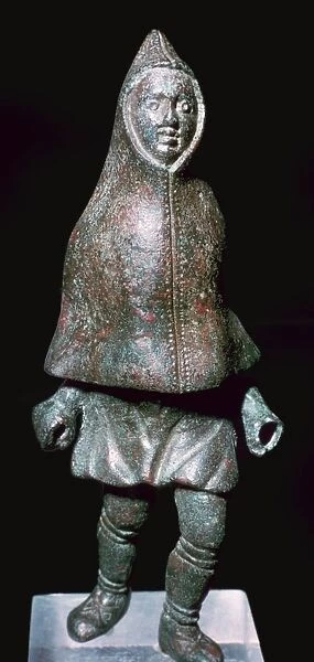 Roman bronze figure of a man wearing a cloak, 4th century