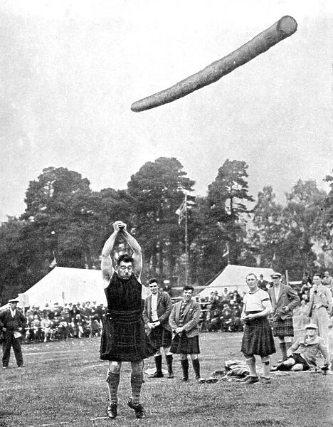 Tossing the caber at the Highland games, Scotland, 1936. Artist: Fox