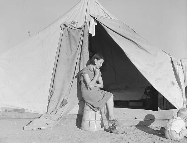 Young migrant mother... FSA emergency camp, Calipatria, California, 1939. Creator: Dorothea Lange