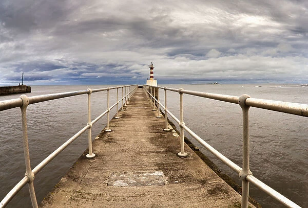 Lighthouse At The End Of A Pier; Amble, Northumberland, England
