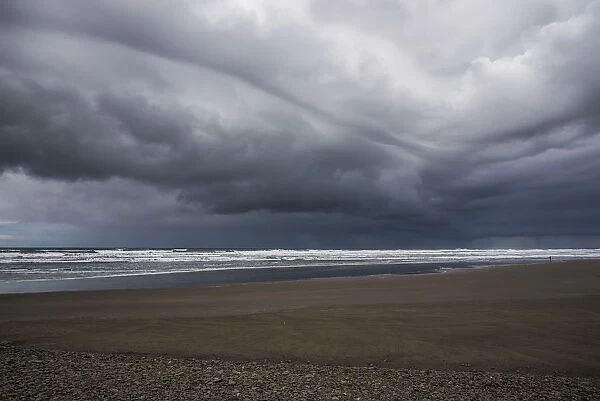 Storm Clouds Loom Over The Beach; Seaside, Oregon, United States Of America