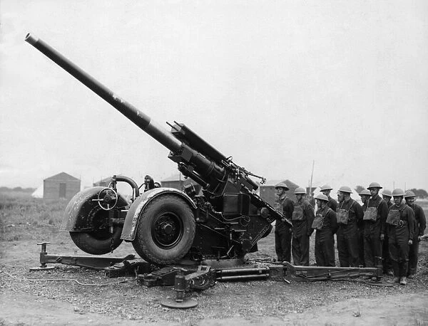 A 3. 7 inch anti aircraft gun crew ready for inspection in the East Riding of Yorkshire