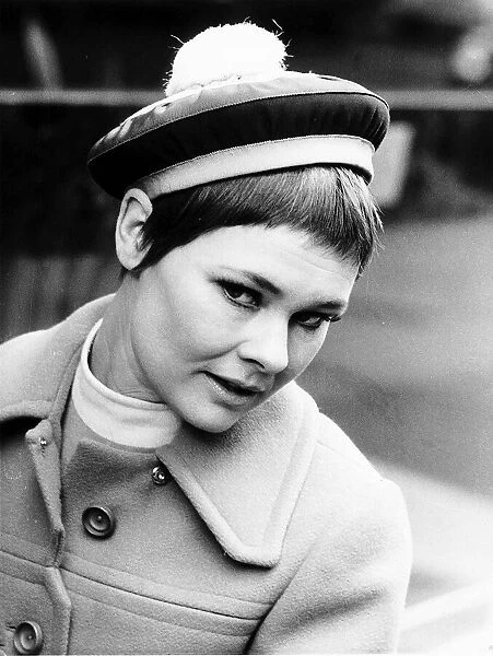 Actress Judi Dench modelling Christian Dior hat from the spring collection called