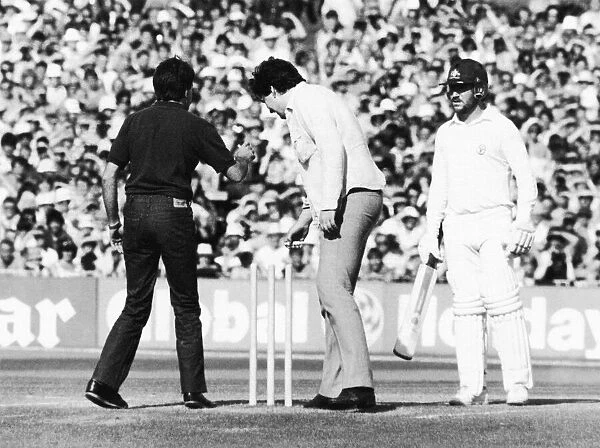 Ashes 1981. Pitch invasion at Old Trafford. Two fans remove the bails in front of a