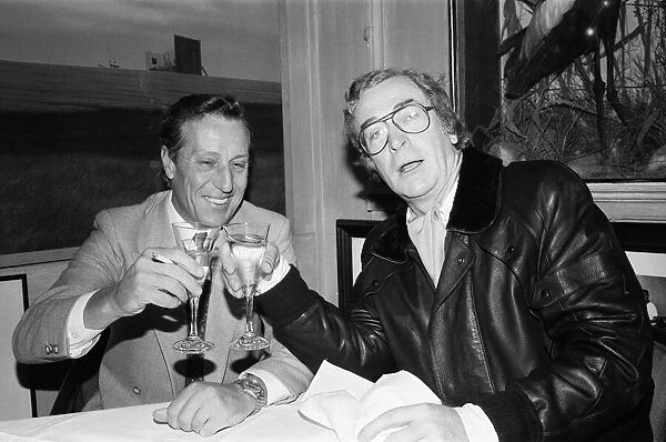 Author Frederick Forsyth having lunch with Michael Caine who starred in the film version