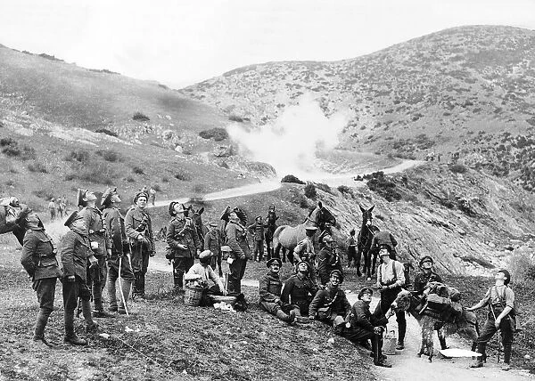 British soldiers standing on hillside with pack horses