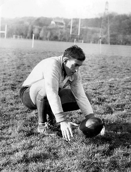 Colin Meads, New Zealand rugby player practising place kicking during a All Blacks