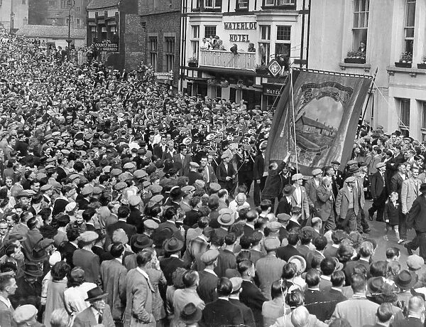 Durham Miners Gala - Miners with pit banners and bands parade through the city