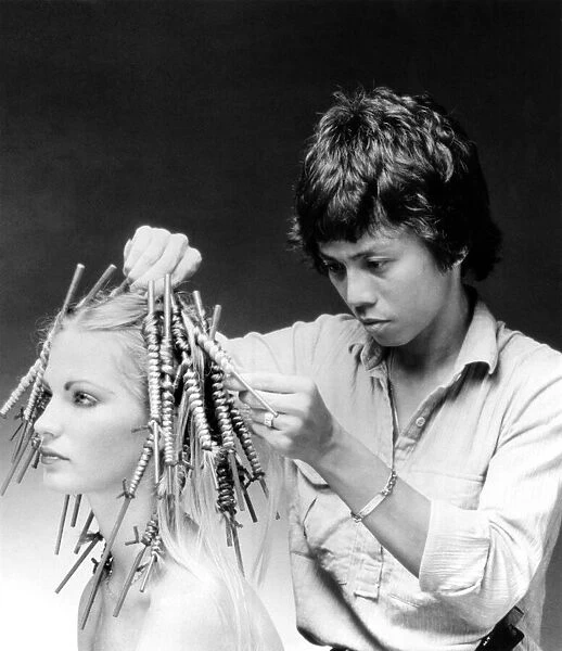 Hairdresser Allan Soh demonstrates the Chinese perm. June 1981 P007893