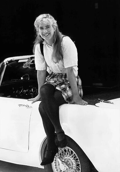 Imogen Stubbs Actress sitting on sports car