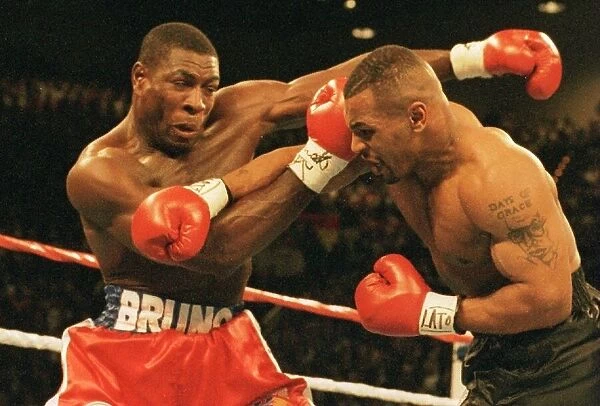Mike Tyson launches an attack on Frank Bruno during the WBC world title fight in Las