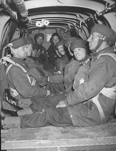 Parachutists inside the bomber plane awaiting the call to jump. Training picture